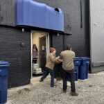 Volunteers helping load food into UW building