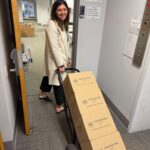 President and CEO Nicole Luczak loading up the food to give to the pantries